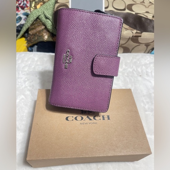 Coach Metallic Purple Wallet
$45 $165 - Picture 2 of 9
